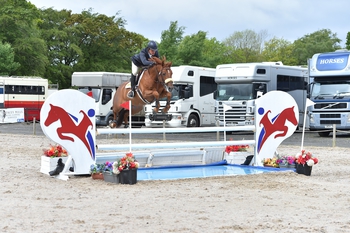 Paul Barker is victorious in the Equitop Myoplast Senior Foxhunter Second Round at Muirmill Equestrian Centre